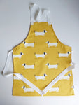 Child's Cotton Apron in an Ochre Dachshund Design
